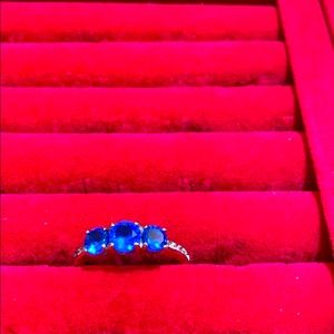 Blue sapphire on a triple plated rhodium band